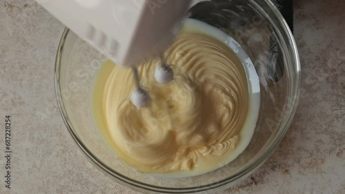 Whipping dough. Making cream or dough. Home cooking. Home cooking concept. Dynamic shooting