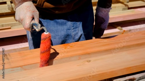 Wallpaper Mural Treating the board with a red protective solution. Selective focus. Torontodigital.ca