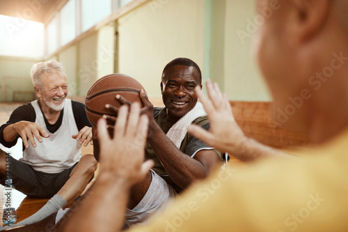 Group of senior men in indoor basketball gym photo