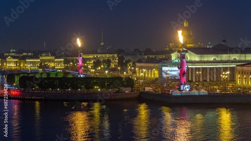 Scarlet Sails Festival Aerial Timelapse Over St. Petersburg City (Russia) from Rooftop. Awe-Inspiring View of Exchange Bridge, Rastralnye Column, and St. Isaac's Cathedral during Festive Night photo