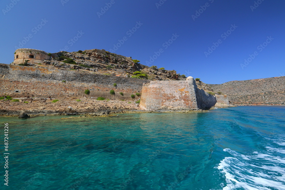 Fototapeta premium Spinalonga Island on a Beautiful sunny day showing the turqoius sea and blue sky. Crete, Greece, Europe.