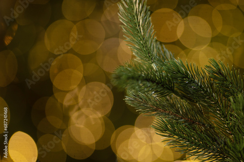 Festive holiday bokeh background from Christmas tree lights on dark background. 