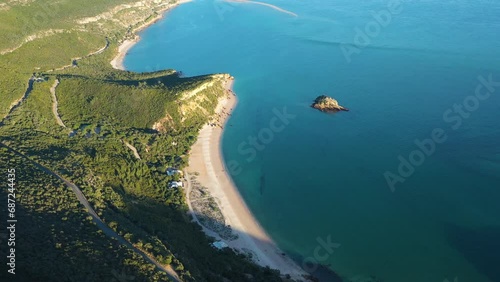 Arrabida Natural Park and Atlantic Ocean. Green Hills and Beaches. Portugal. Aerial View. Drone Moves Forward, Tilt Down photo