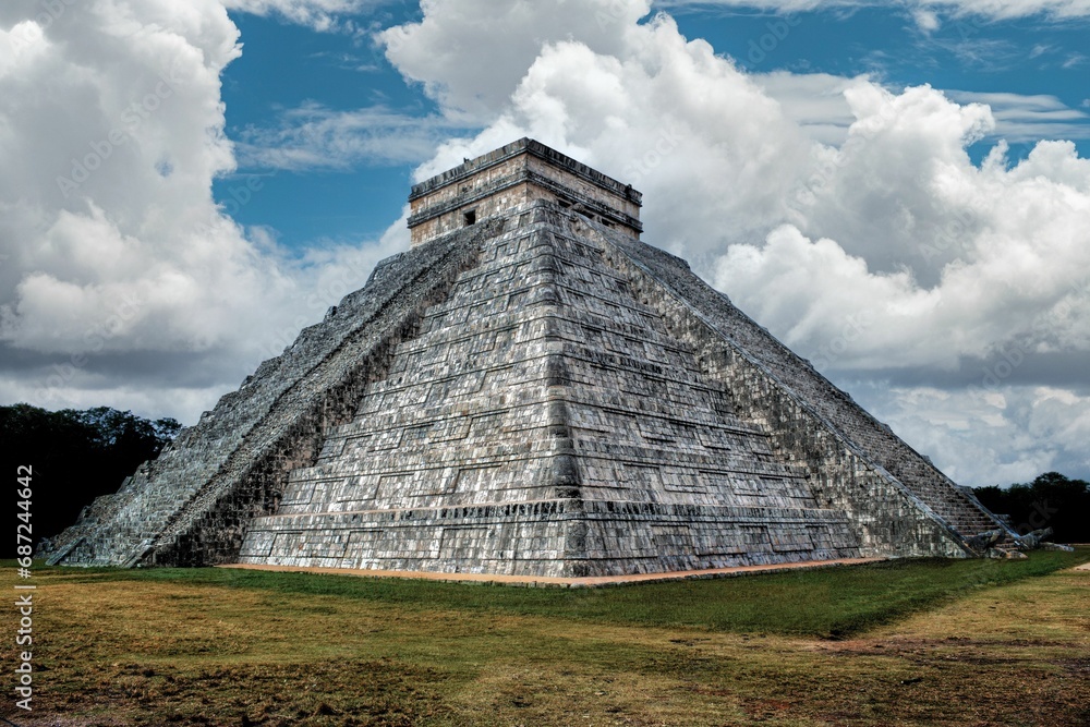 Scenic view of Chichen Itza Pyramid in Mexico under a beautiful cloudy sky