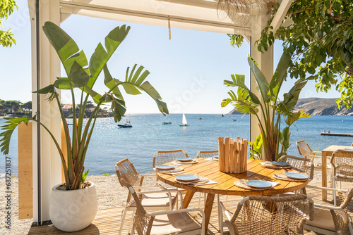 restaurant with a table overlooking the sea, on the Costa Brava on a summer day