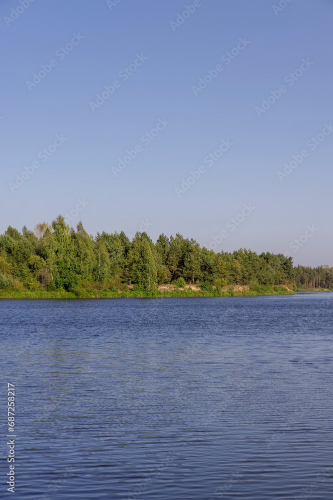 a wide river in sunny weather in early autumn a wide river in sunny weather in early autumn
