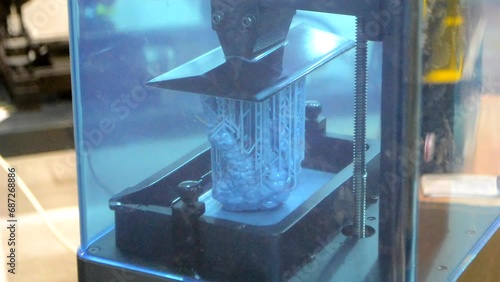 3D printer working process. 3D printing. Stereolithography photopolymerization SLA. Additive manufacturing technology. Liquid materials, hard part, creating layers. 3D model ultraviolet polymerization photo