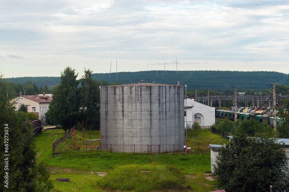 Fototapeta premium a tank for gasoline and oil near the railway tracks