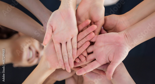 Business teamwork group of young women hands. Stacked huddle together. Unity international