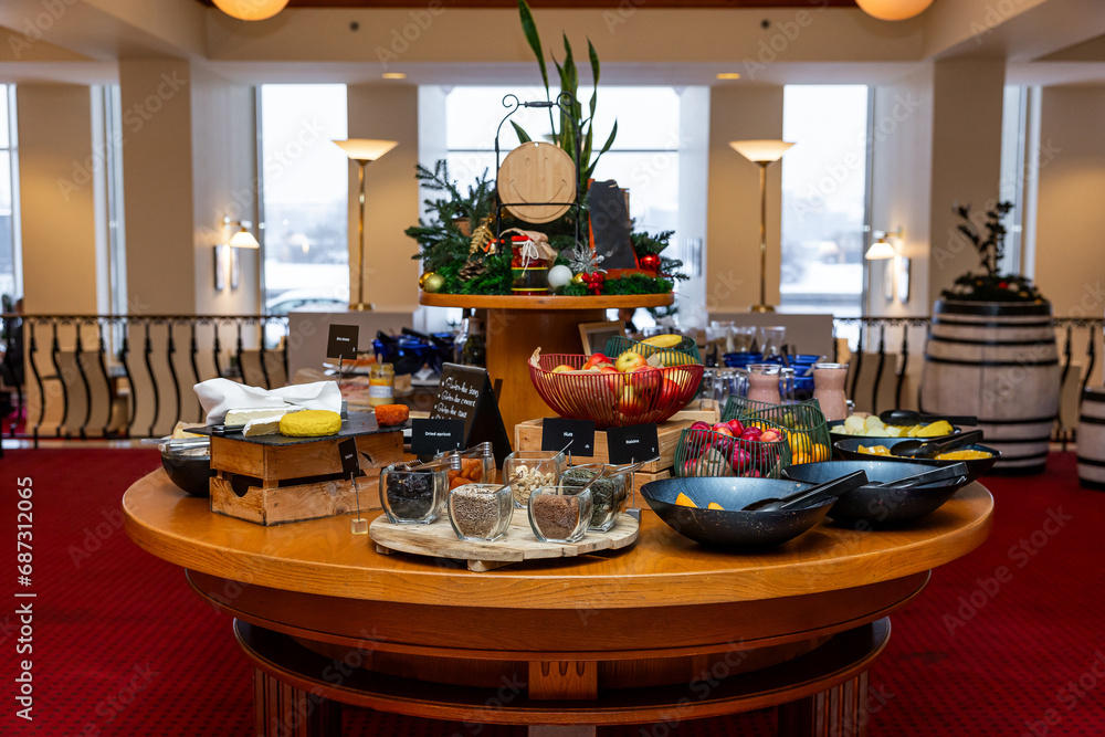 Festive Circular Buffet Table Display with Seasonal Decor and Assorted Breakfast Items