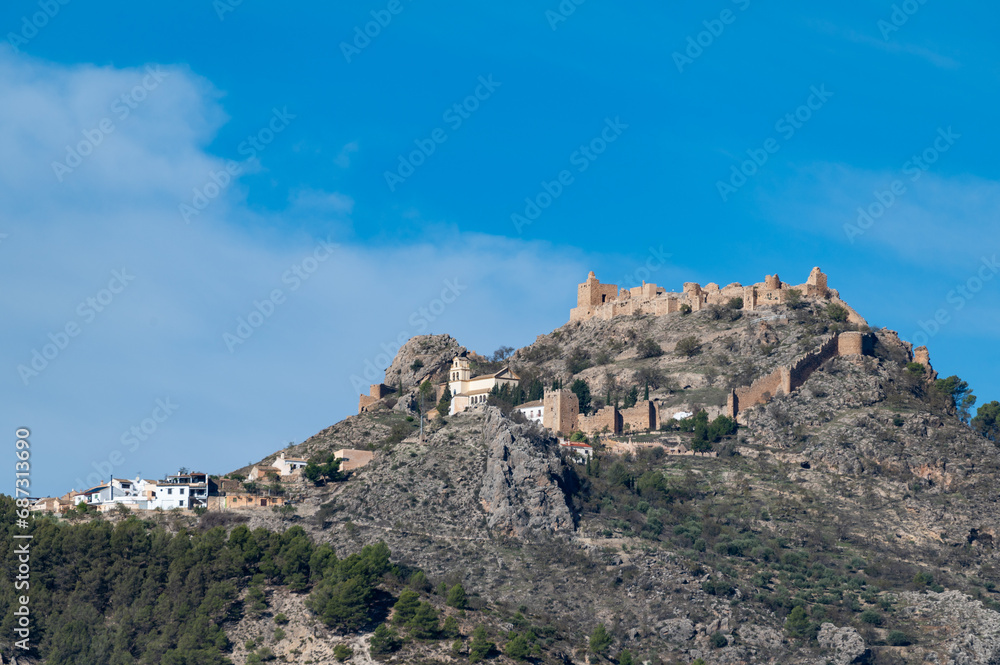 View of the fortified Andalusian village of Moclín on top of a mountain