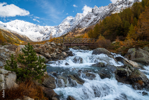 White water of a mountain creek in autumn photo