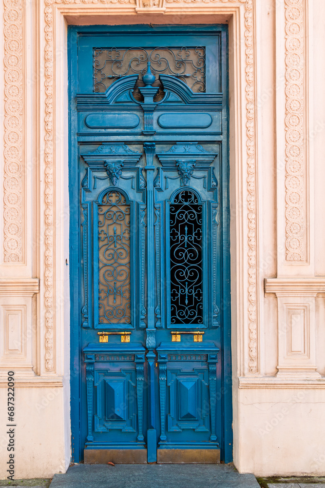 travel to Georgia - ornamental carved wooden door at entrance to residential apartment building in Batumi city on autumn day
