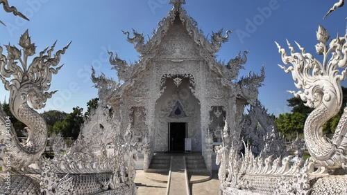 Chiang Rai, Thailand - November 27, 2023: White Temple or Wat Rong Khun is one of the landmark of Chiang Rai Province. It was created by Mr.Chalermchai Kositpipat, the famous Thai artist.