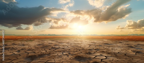 Dry cracked parched earth with sky blue and horizon. Global warming concept and climate change