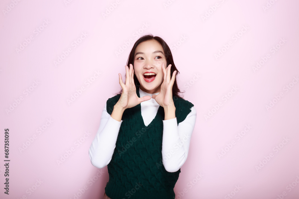 Shouting with mouth wide open, friendly young woman, Asian woman with open mouths raising hands screaming announcement isolated on pink background. Shouting with mouth wide open, friendly young woman, Asian woman with open mouths raising hands screaming announcement isolated on pink background.