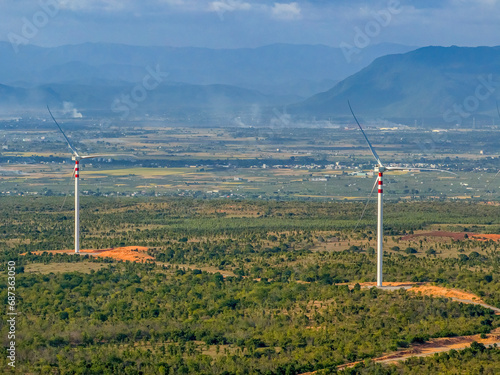 Landscape with Turbine Green Energy Electricity, Windmill for electric power production, Wind turbines generating electricity on rice field at Binh Thuan, Vietnam. Clean energy concept.