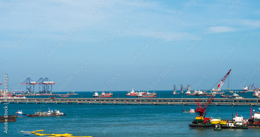 Logistic shipping quay boat Engineering crane depot at logistic export terminal control. Warehouse freight background container yard loading quayside harbor port. Logistics seascape shipping portal