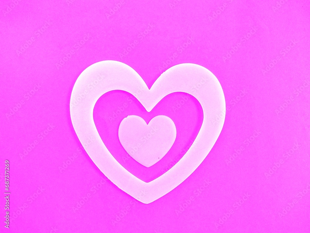 White hearts on pink background for Valentine's Day.