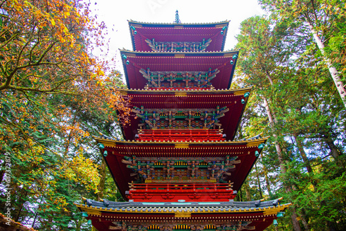 Japan - November 13, 2023 : Scenic exterior architecture of Five Storeys Pagoda of Toshogu Shrine in autumn, One of most popular tourist destination in Nikko photo