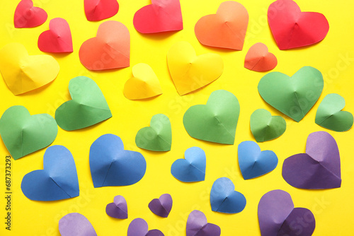 Colorful paper hearts on ye...