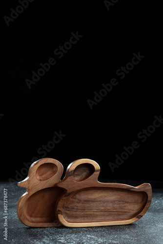 The children's plate in the shape of a duck is made of wood for serving snacks, fruits, nuts, cheeses, meat and original serving of main dishes. Accessories for a modern kitchen.