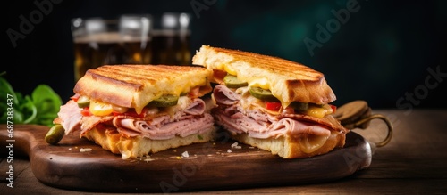 Classic Cuban sandwich on a board with cheese, ham, and fried pork.
