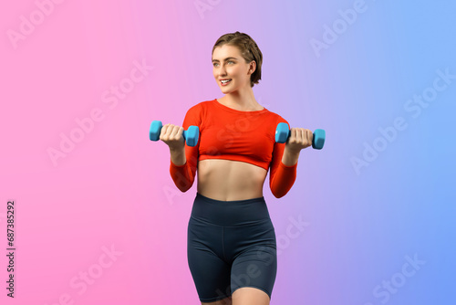 Full body length gaiety shot athletic and sporty woman with dumbbell for weight lifting as bodybuilding exercise in standing posture on isolated background. Healthy active and body care lifestyle