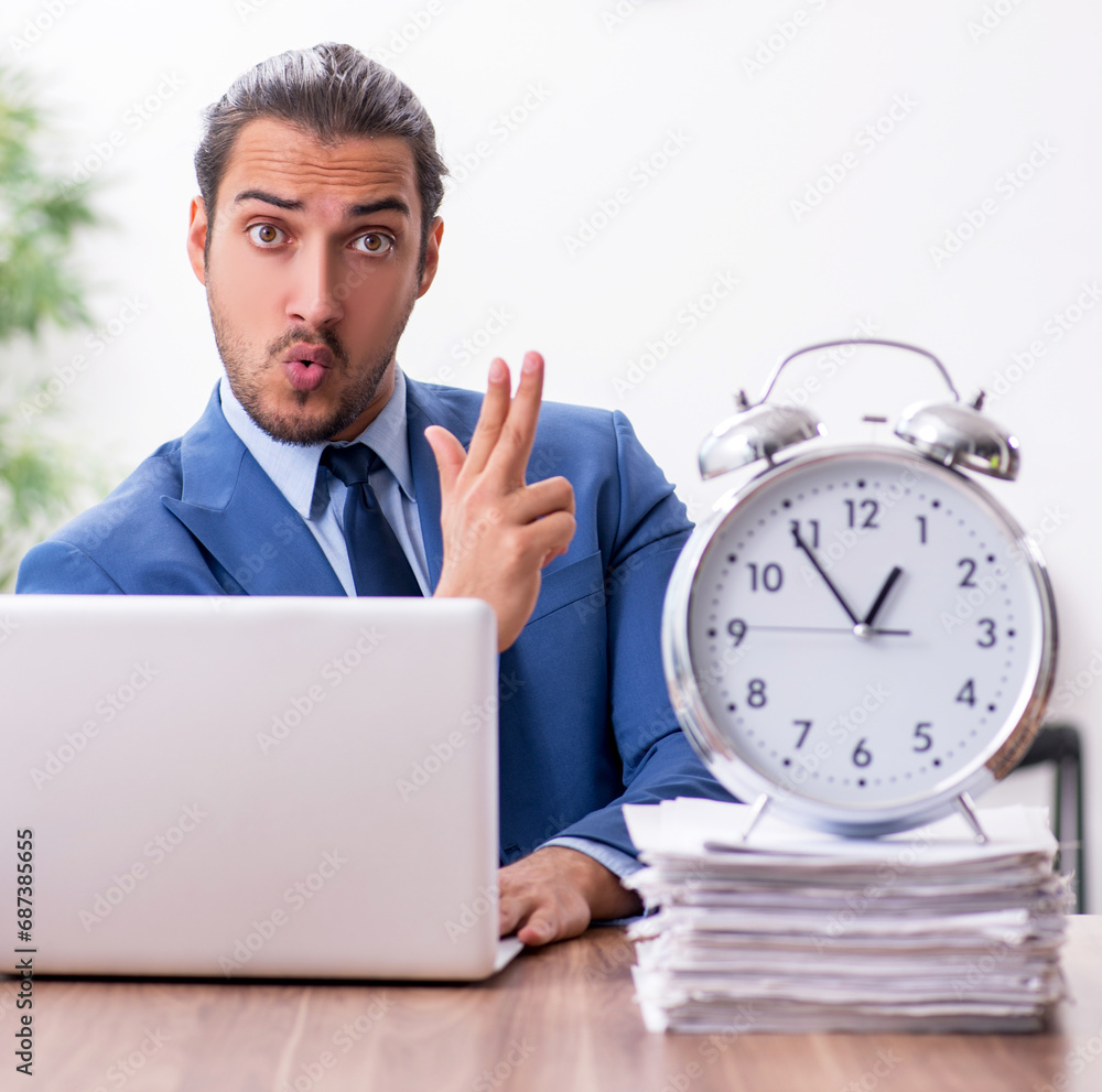 Young male businessman working in the office Young male businessman working in the office