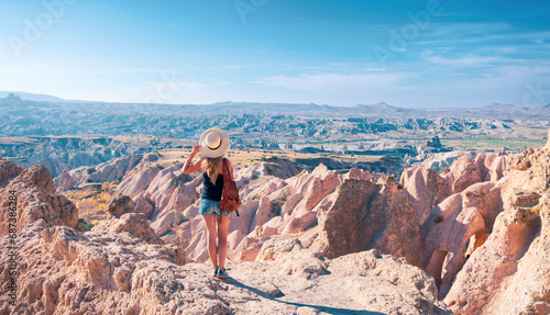 Rear view of traveler woman in Cappadocia- Adventure, excursion, travel destination in Turkey