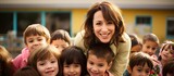 Preschool teacher embracing kindergartners and relishing return to school.