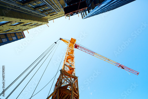 A construction crane is erecting a building