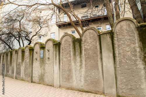 Krakow, Poland - march 7, 2023: Fragment of the wall of Jewish Ghetto in Krakow, Poland. Ghetto Walls were built in style of Jewish graves symbolizing destiny of enslaved people. photo