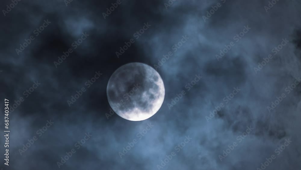 Mesmerising time lapse of clouds and full moon. Perfect for mystical and atmospheric content. Close-up of the moon and craters against the clouds Mesmerising time lapse of clouds and full moon. Perfect for mystical and atmospheric content. Close-up of the moon and craters against the clouds