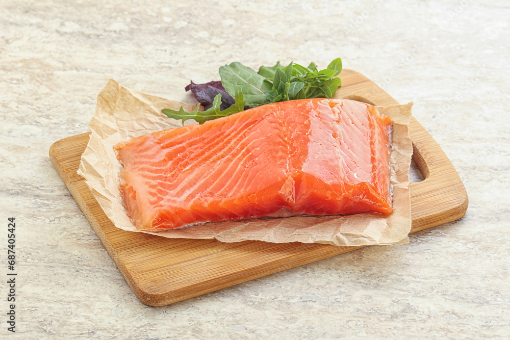 Raw salmon fillet over board Raw salmon fillet over board