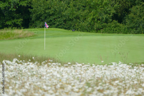 Traditional England golf course with Great Britain flag