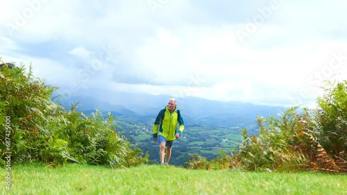 Mature man hiking on 'La Rhune' in the French Basque Country photo