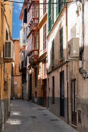 Fototapeta Naklejka Na Ścianę i Meble -  Traditional Narrow street in the old town of Palma de Mallorca, Spain