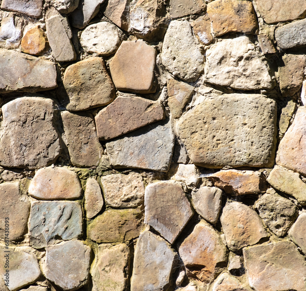 Fototapeta premium Stone bricks on the wall as an abstract background. Texture