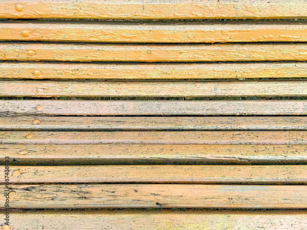 Yellow wooden boards on a bench as an abstract background. Texture