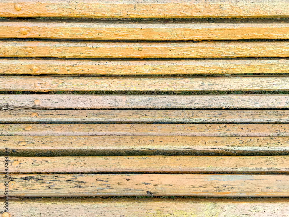 Yellow wooden boards on a bench as an abstract background. Texture Yellow wooden boards on a bench as an abstract background. Texture