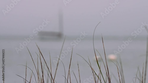 Red Boat out of Focus in Nantucket Harbor Gray, Rainy Day