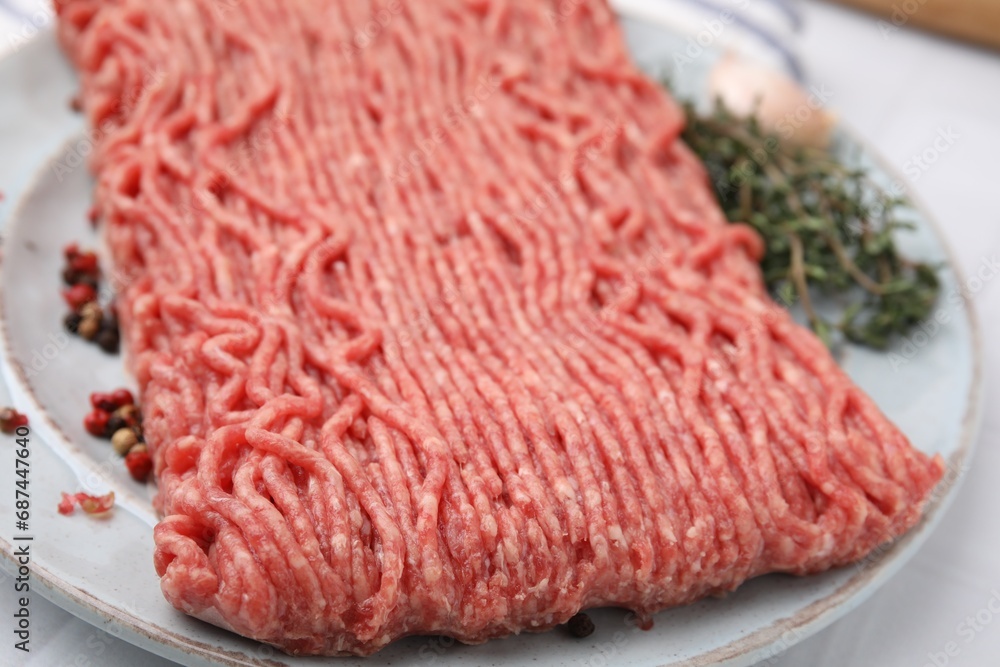 Fresh raw ground meat and spices on table, closeup Fresh raw ground meat and spices on table, closeup
