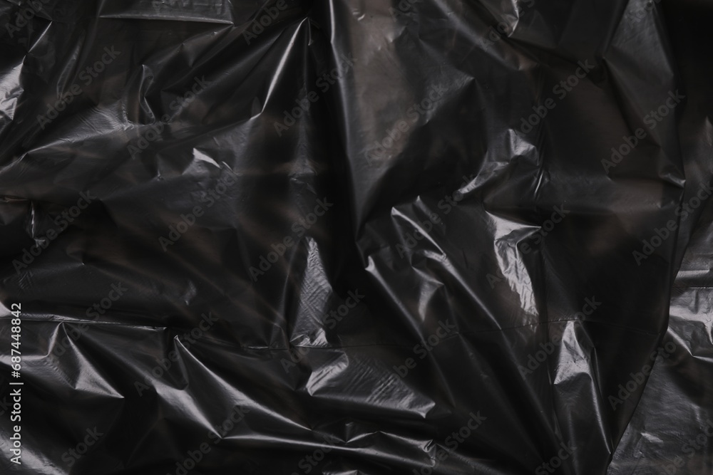 Texture of black plastic bag as background, closeup Texture of black plastic bag as background, closeup