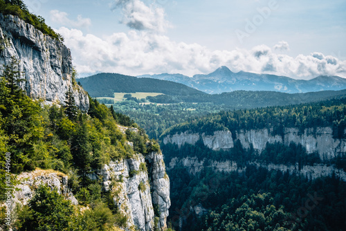 View on the Alps and the mountains of Vercors mountain range from the hiking trail of the Bourne river canyon in the French Alps (Isere) photo