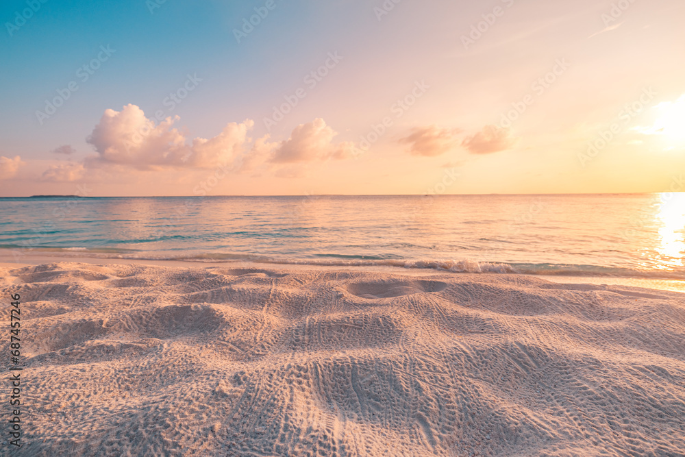 Closeup beach coast sand texture with warm gold orange sunset light. Fantasy beach landscape sky sea bay. Tranquil relax bright horizon, colorful sky. Peaceful nature seascape. Summer Mediterranean
