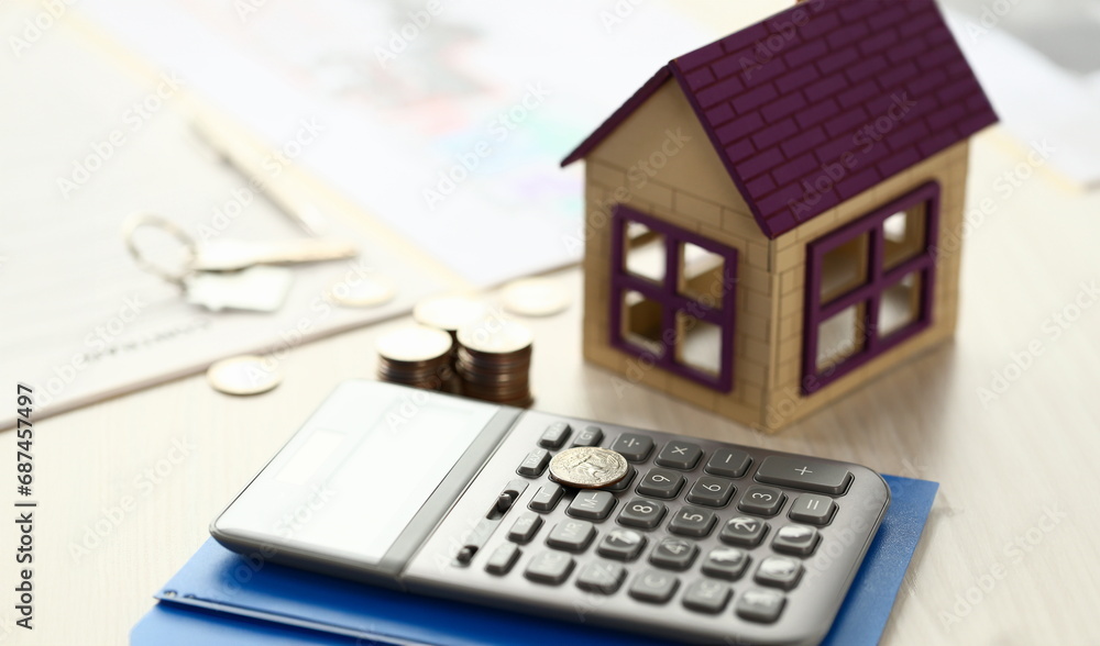 Architect Sales Broker Work Tools Lay on Table. Calculator, Coins, House on Desk. Notebook, Agent Business Contract Close Up Shot. Broker Assessment of Lease Deal for Insurance Paper Architect Sales Broker Work Tools Lay on Table. Calculator, Coins, House on Desk. Notebook, Agent Business Contract Close Up Shot. Broker Assessment of Lease Deal for Insurance Paper