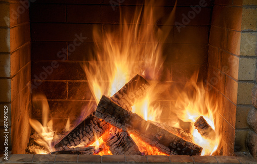Fire in the fireplace of a country house  cold winter  Christmas  holiday.