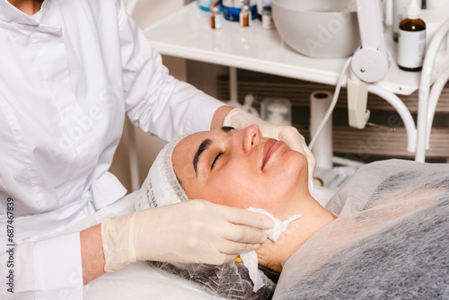 Applying a facial mask in a skin care clinic for facial skin elasticity