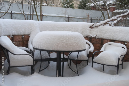 Wallpaper Mural Tables and chairs covered with snow in a snow covered patio. snow on the table and chairs. Fabulous winter. Christmas time. Winter storm covers the deck and outdoor furniture. Torontodigital.ca